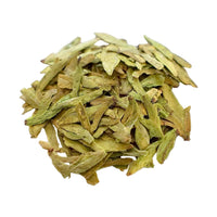 west lake longjing from zhejiang, china: a small pile of flat, yellow-green loose leaf